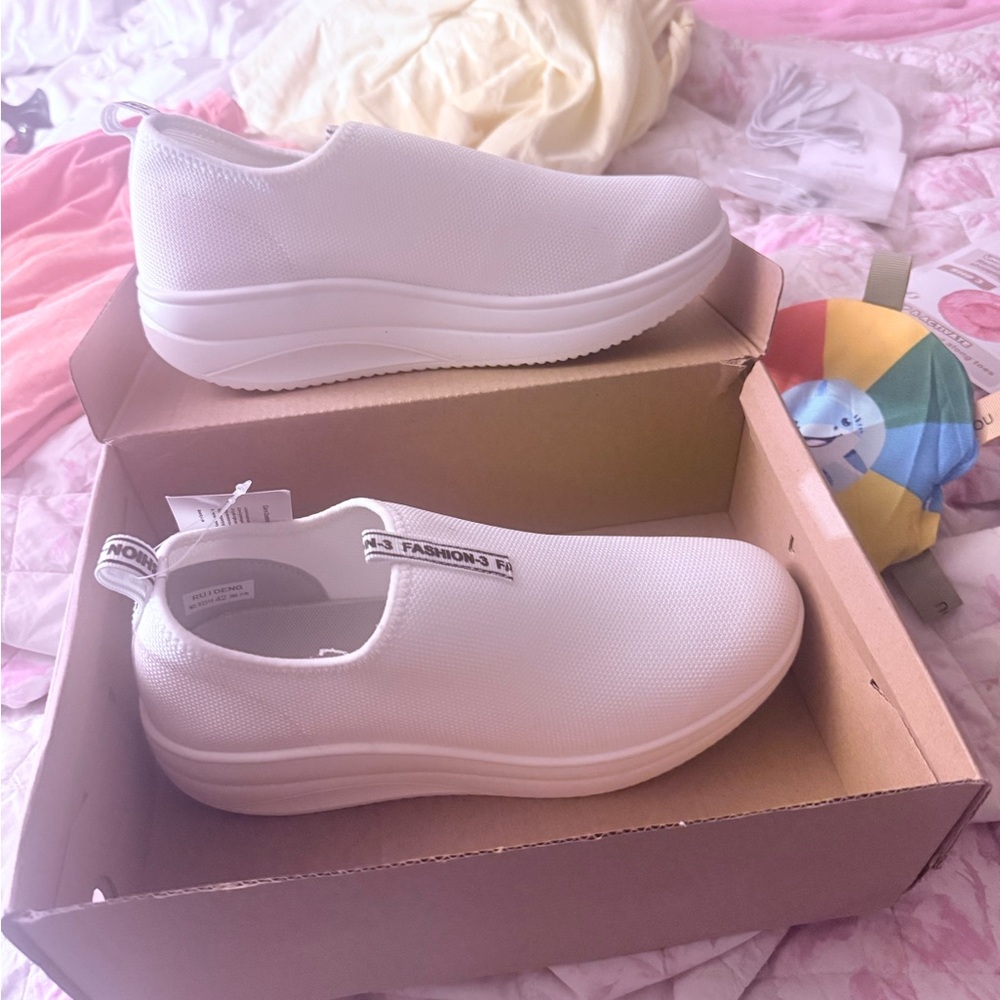 Women’s White Slip-On Athletic Sneakers —